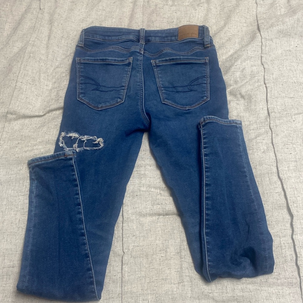 American Eagle cozy next level stretch denim ripped covered pants size 0 Regular